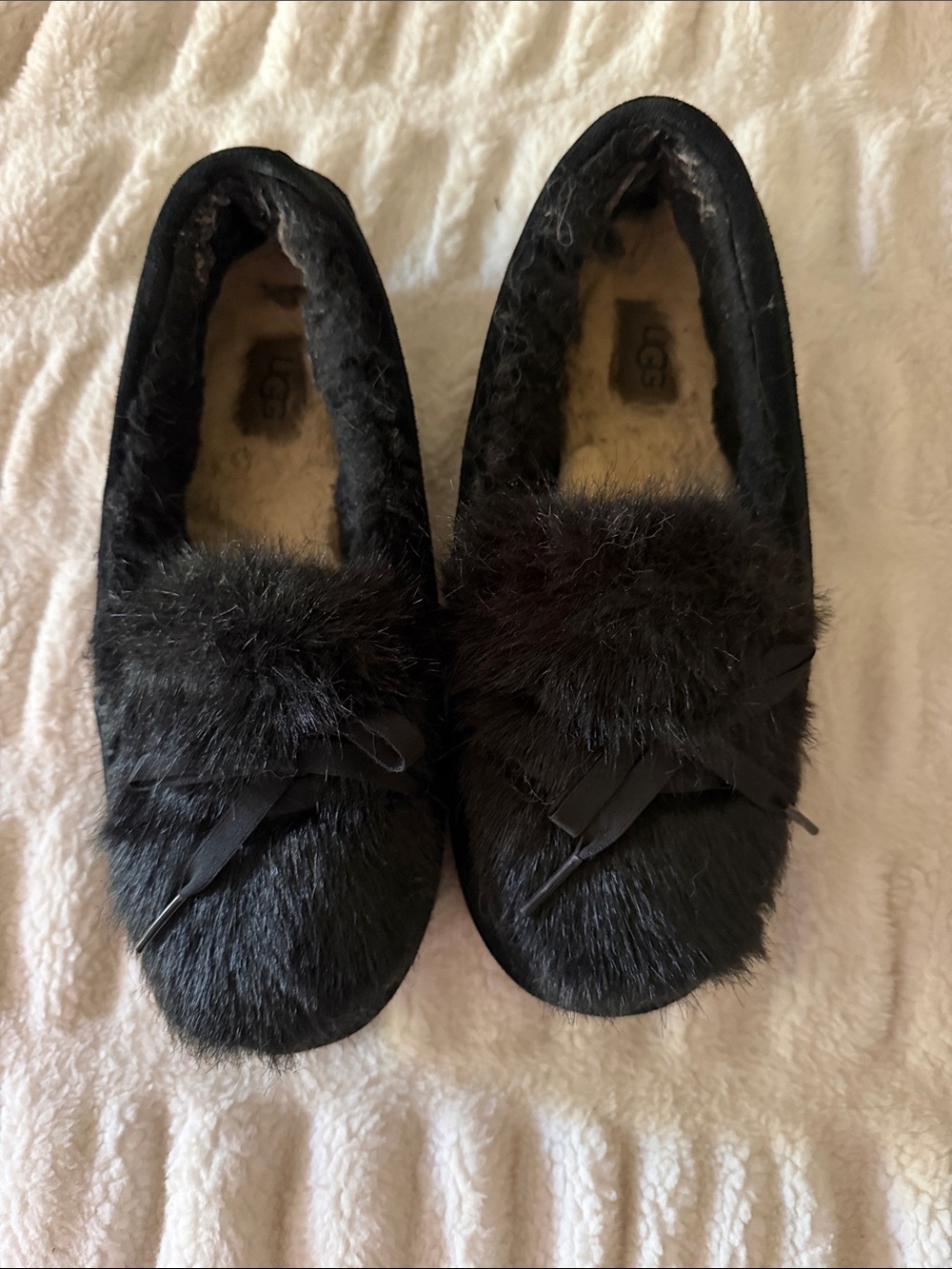 UGG Women's Black Fur Pom Moccasins